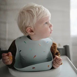 Mushie Silicone Baby Bib in Sparrow