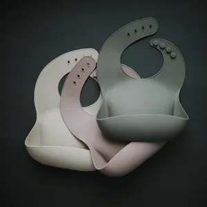 Mushie Silicone Baby Bib in Sparrow